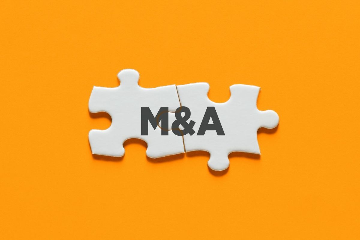 "M&A" written on puzzle pieces.