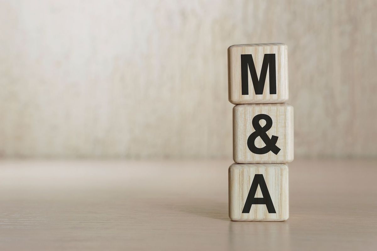 "M&A" written on wooden blocks.