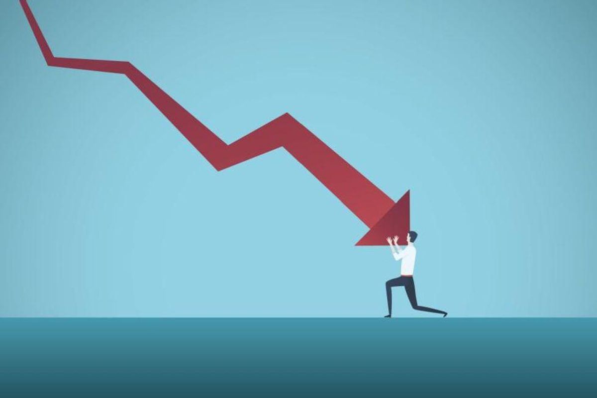 man being crushed by red down arrow