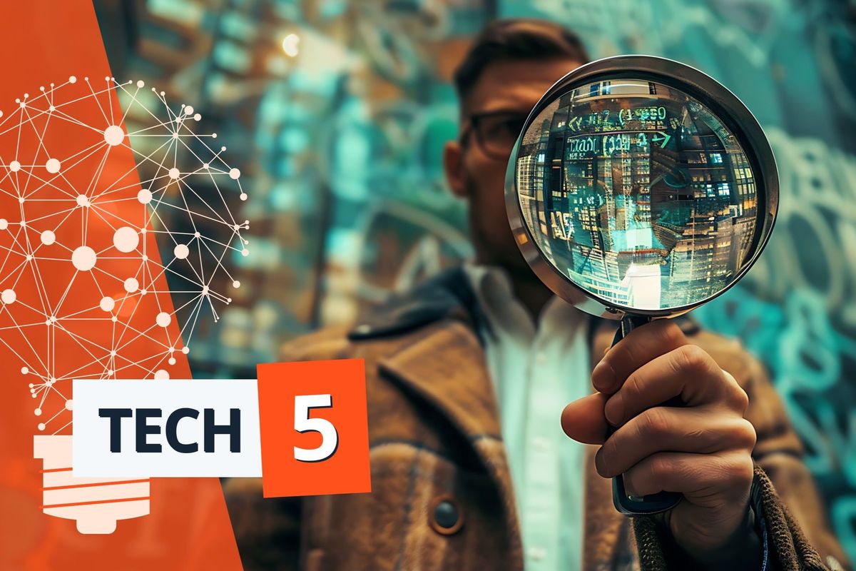 Man holds up a magnifying glass reflecting lines of computer code.