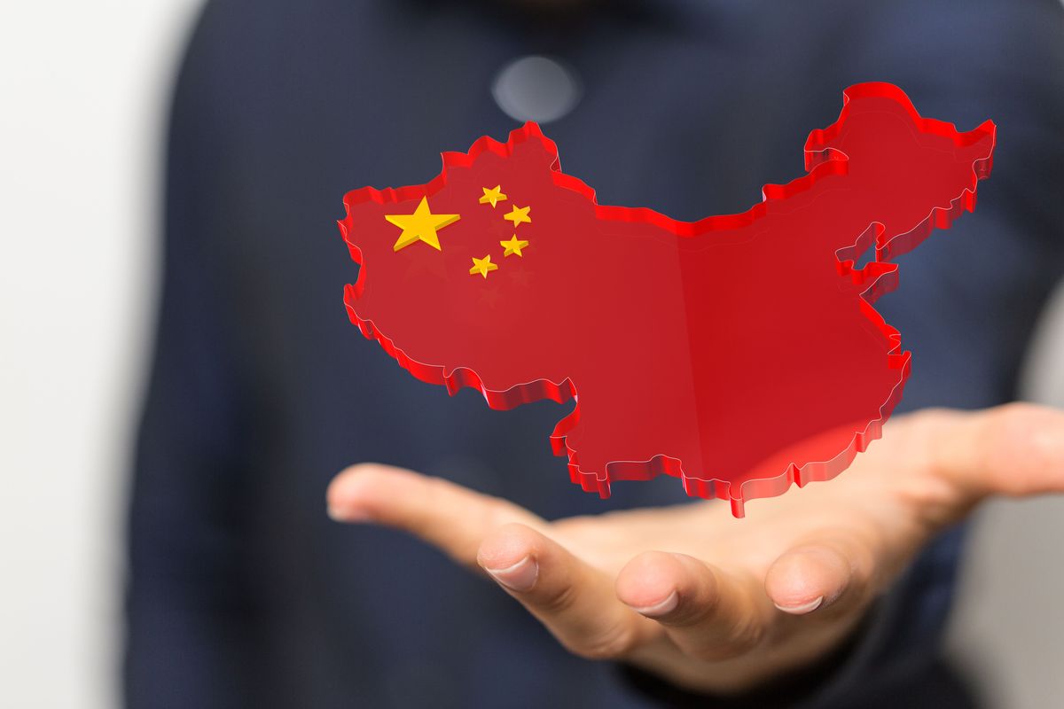 Map of China outline with Chinese flag superimposed.