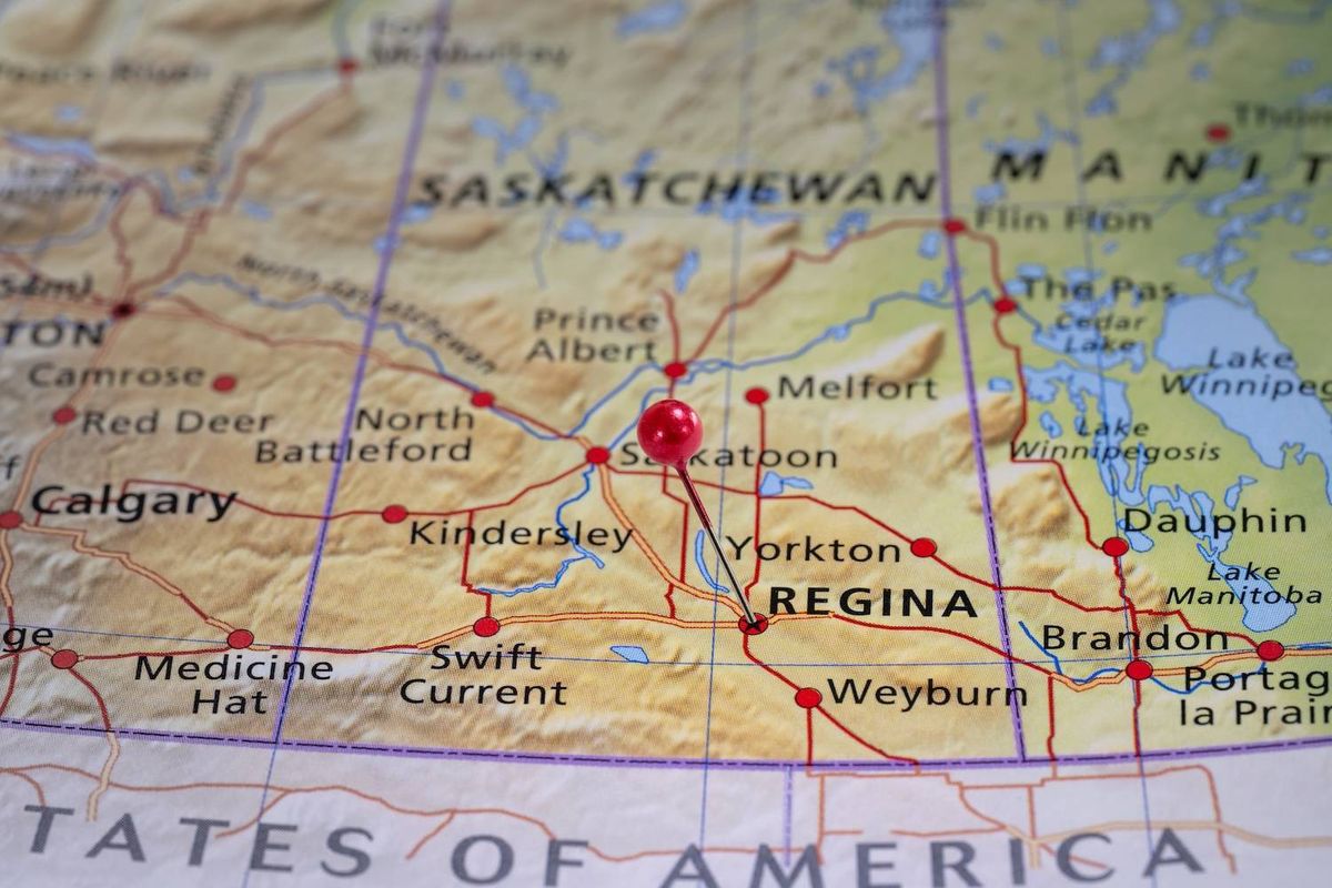 Map with a red pin over Regina, Saskatchewan, showing cities like Calgary, Saskatoon, and Brandon; Text reads: REGINA.