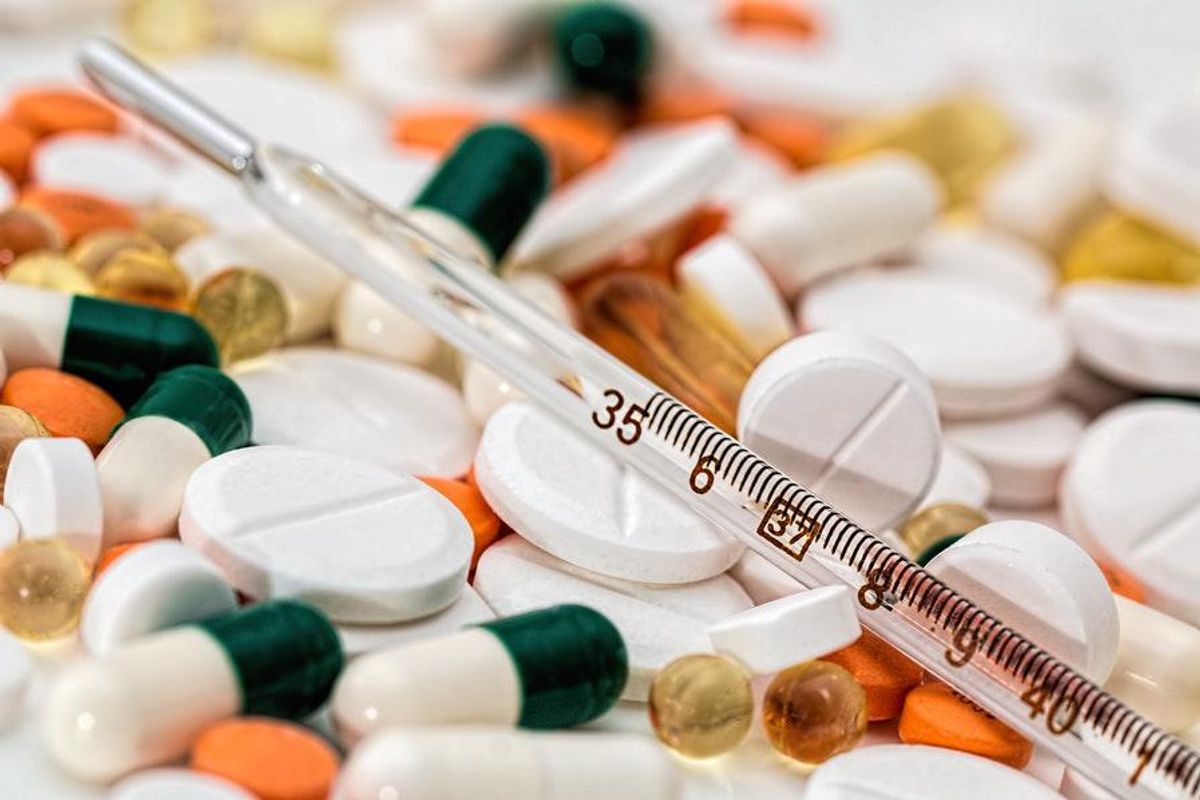medical pills and thermometer