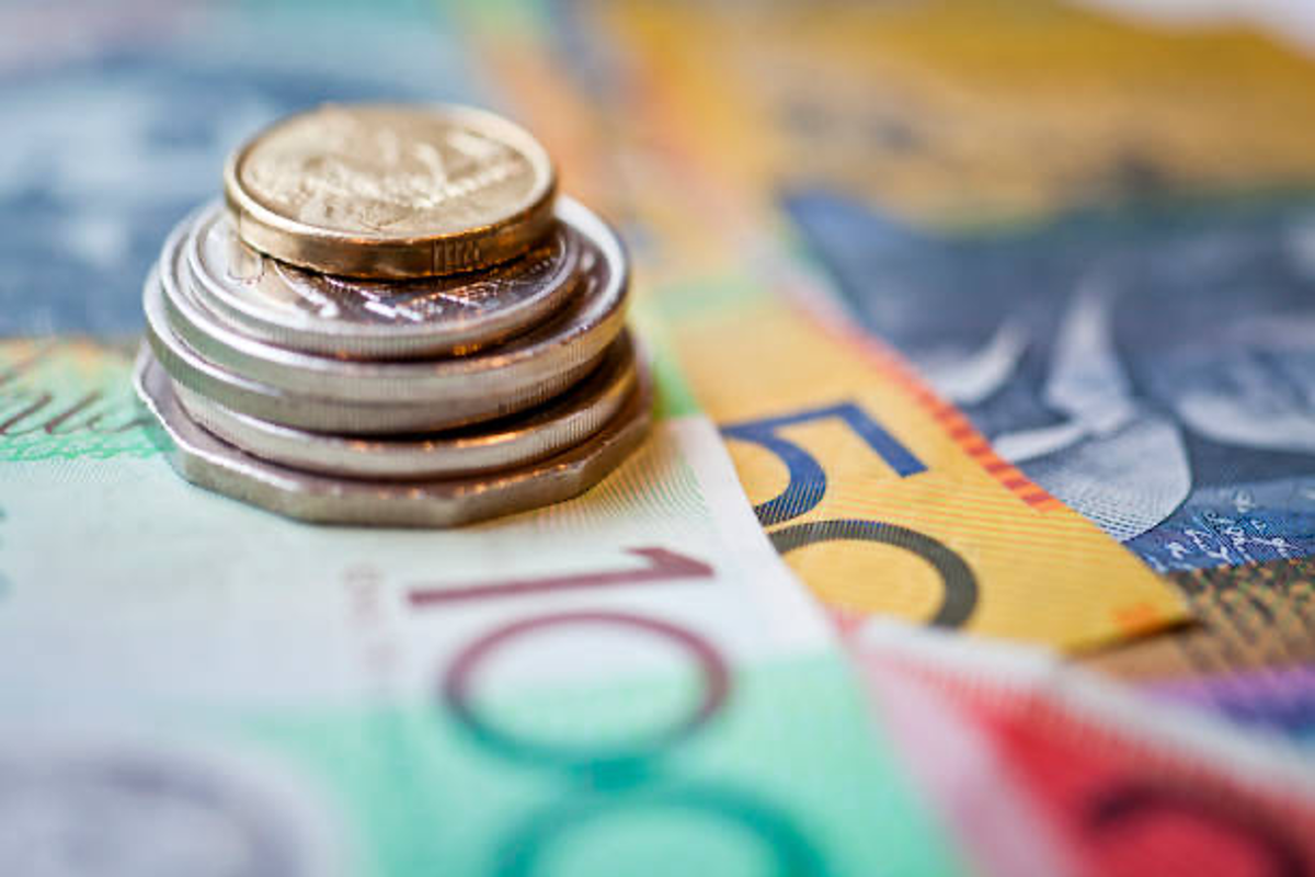metal coins on a bed of australian money.