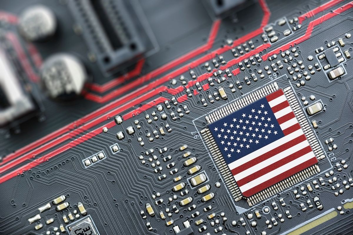 Microchip with American flag design on a circuit board.