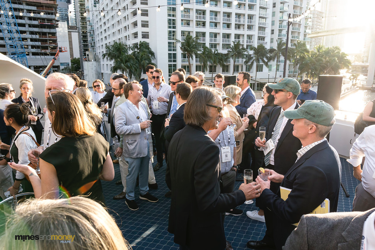 Mining professionals networking outdoors at Mines and Money Miami.