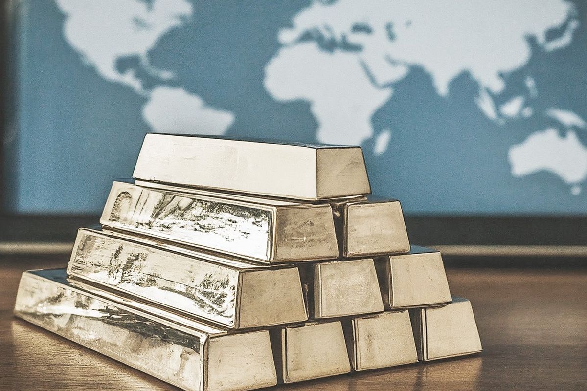 Nickel bars in front of a world map.