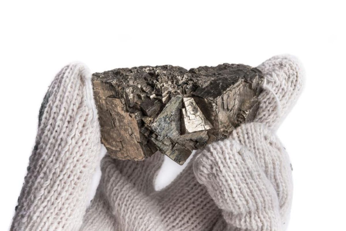 nickel in gloved hand