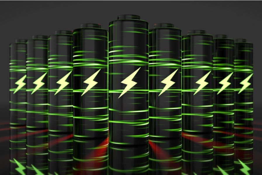 nine green and black batteries in a line