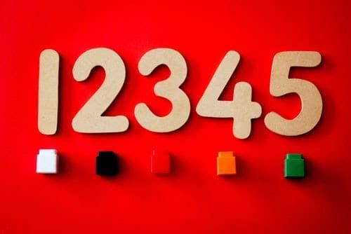 numbers 12345 on a red background above small blocks in various colors