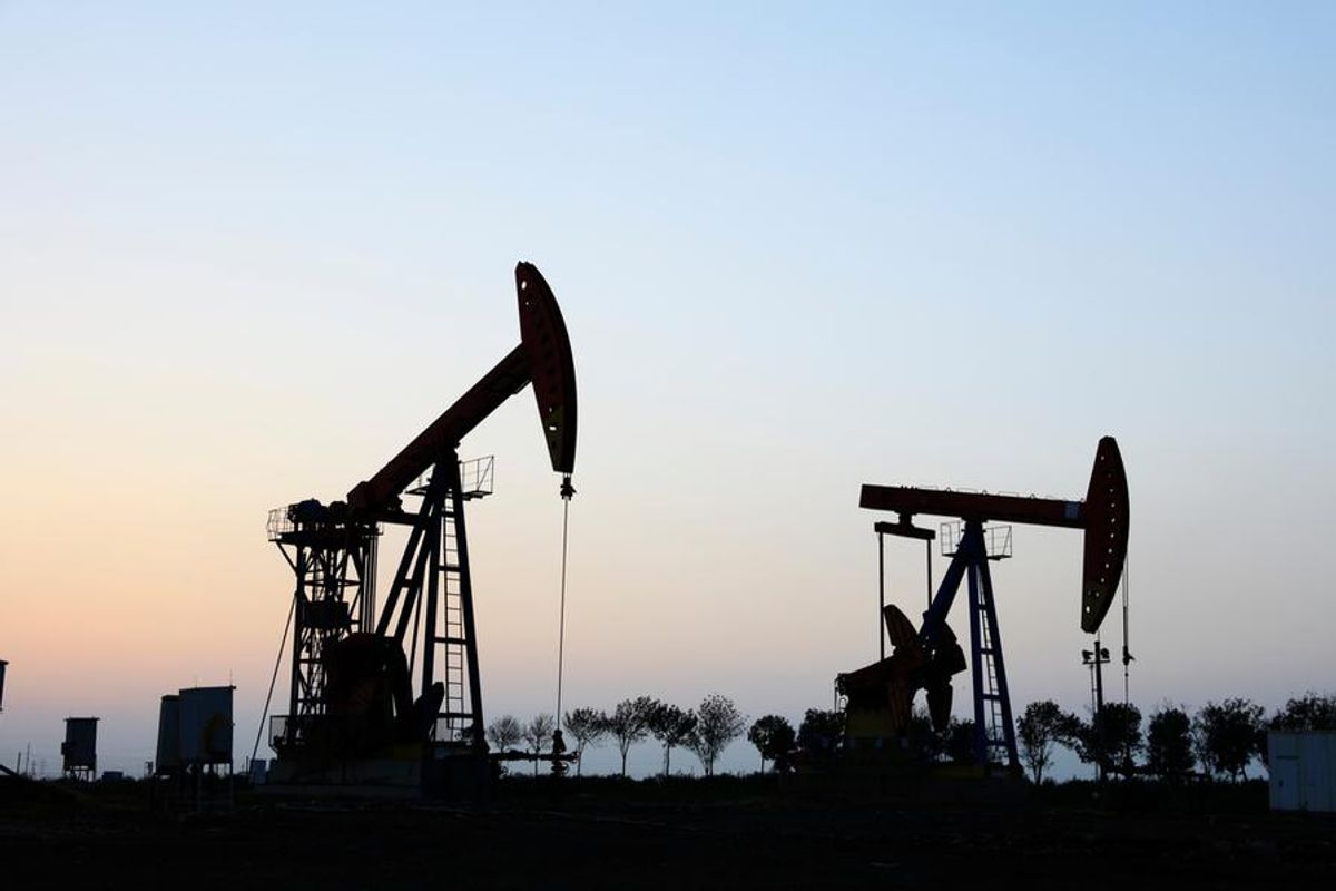 oil rigs at dusk