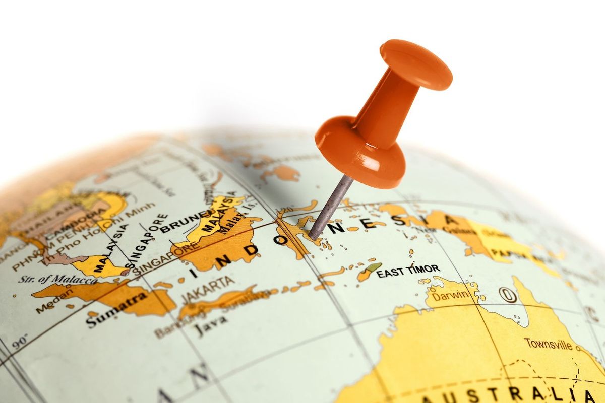 Orange pushpin on a map marking Indonesia.