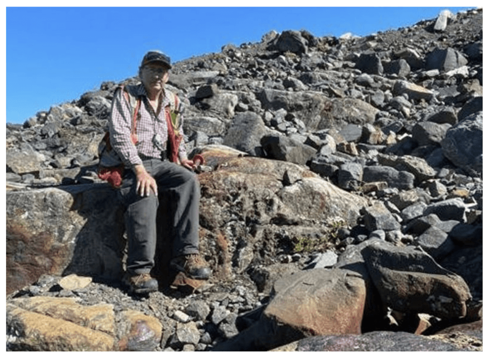 Oreterra Metals rocky terrain under a clear blue sky.