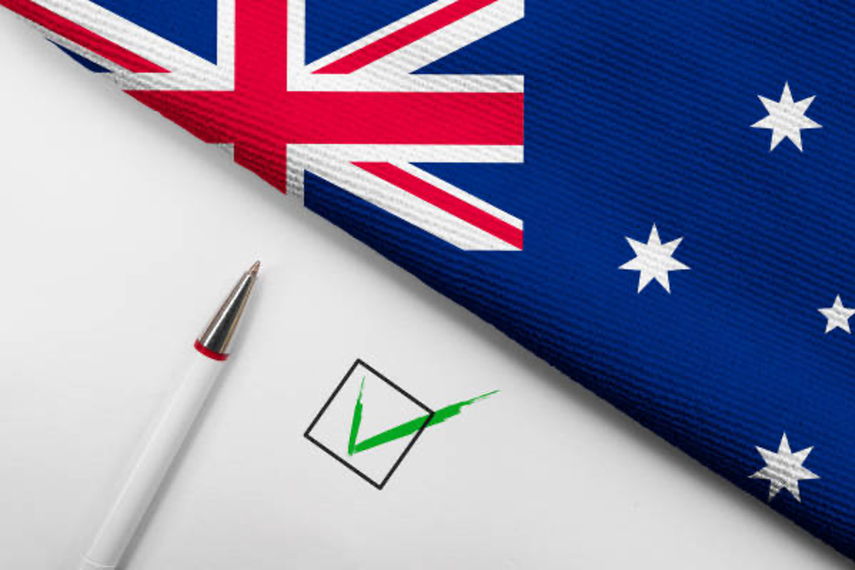 Pen and check mark with Australian flag.