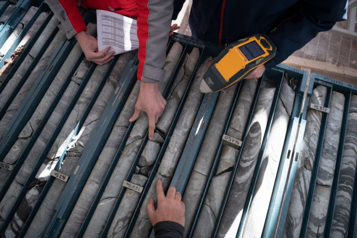 people looking at drill cores