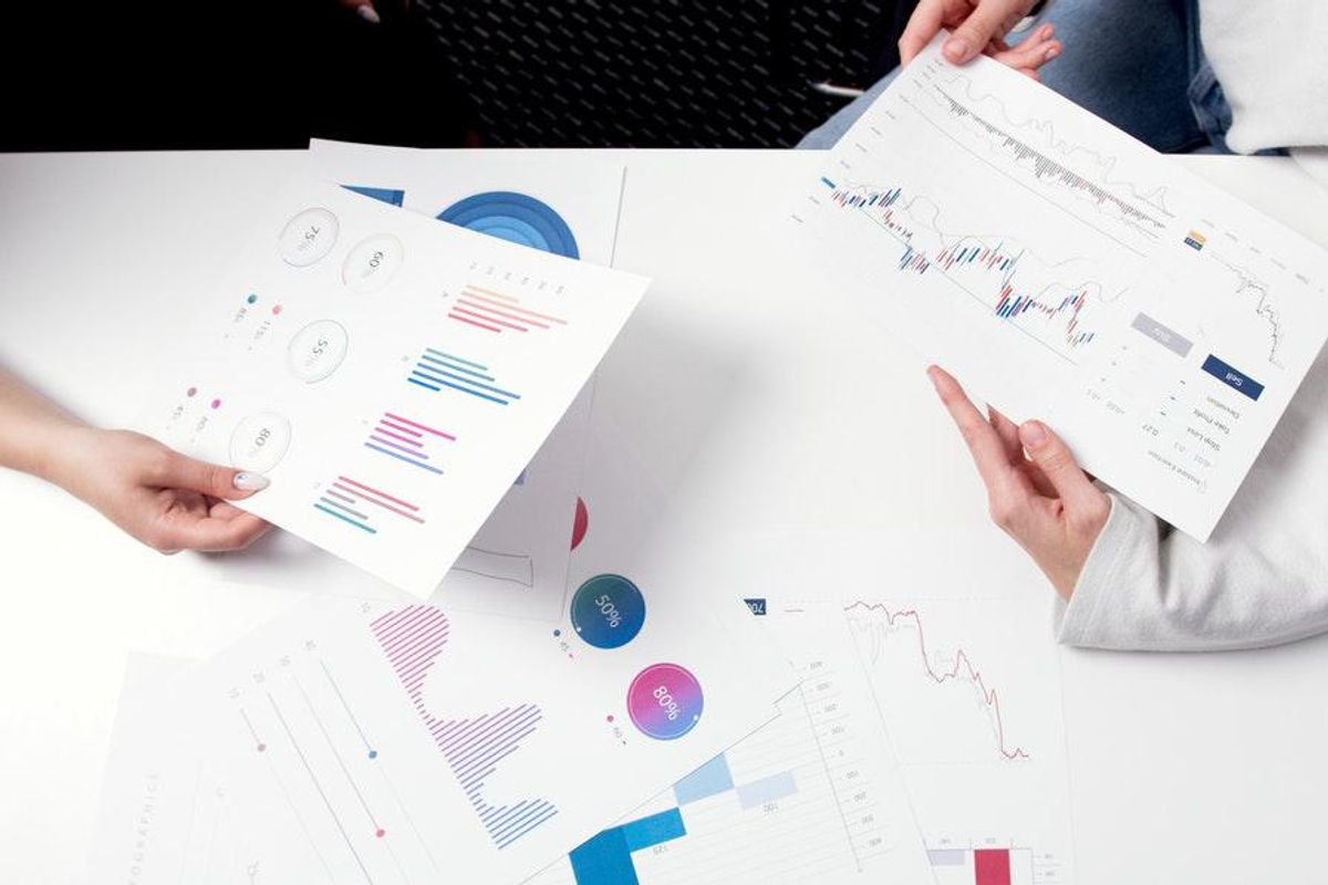 people reviewing papers with charts