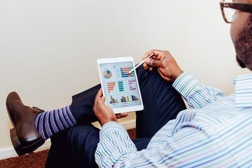 person reading charts on a tablet