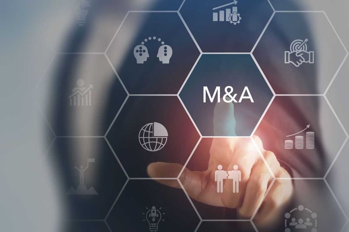Person selecting "M&A" on touch screen.
