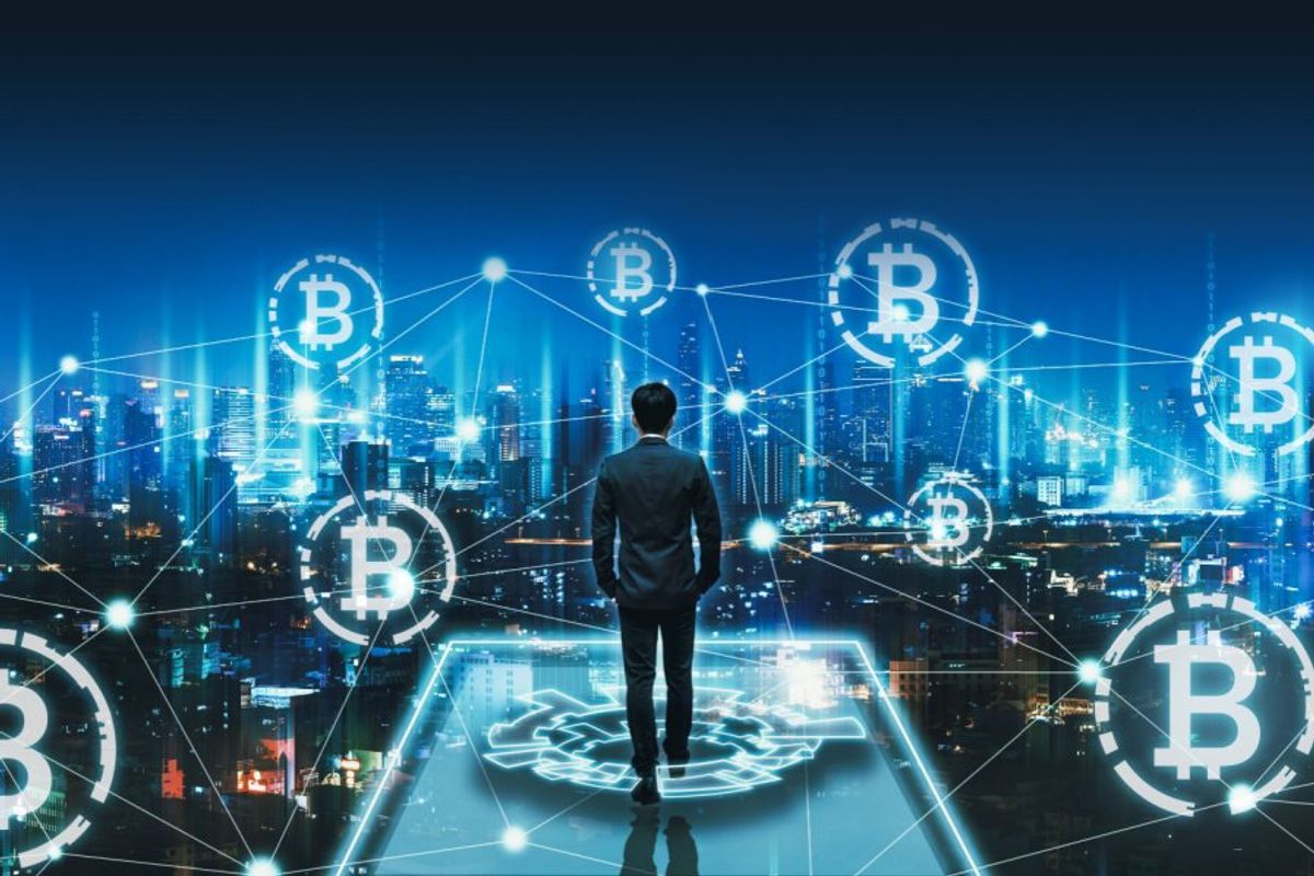 person surrounded by bitcoin symbols