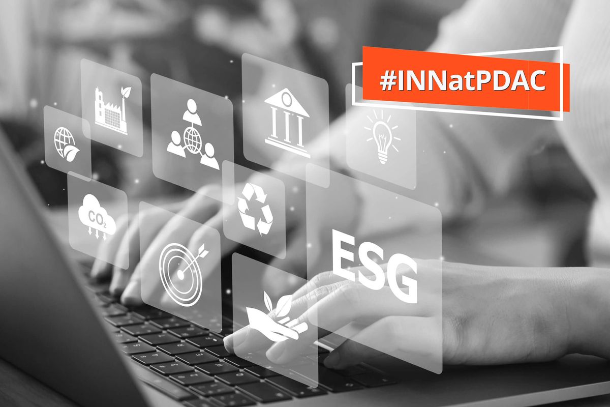 Person typing on laptop with ESG icons floating above.