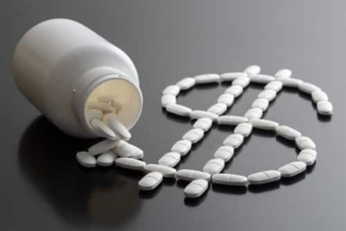 pharmaceutical pills spilling out of bottle to form a dollar sign