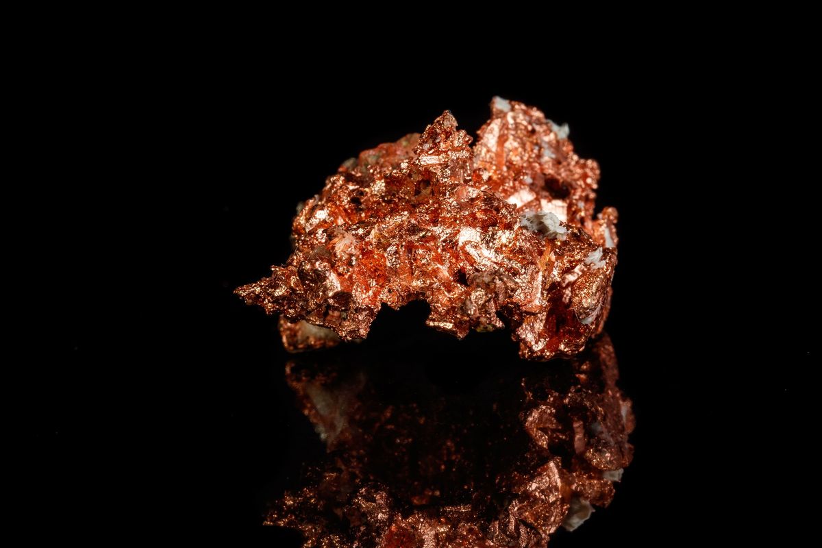 Piece of copper on black background.