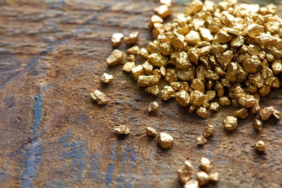 pieces of gold ore on a table