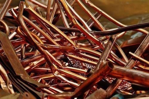pile of copper pipes