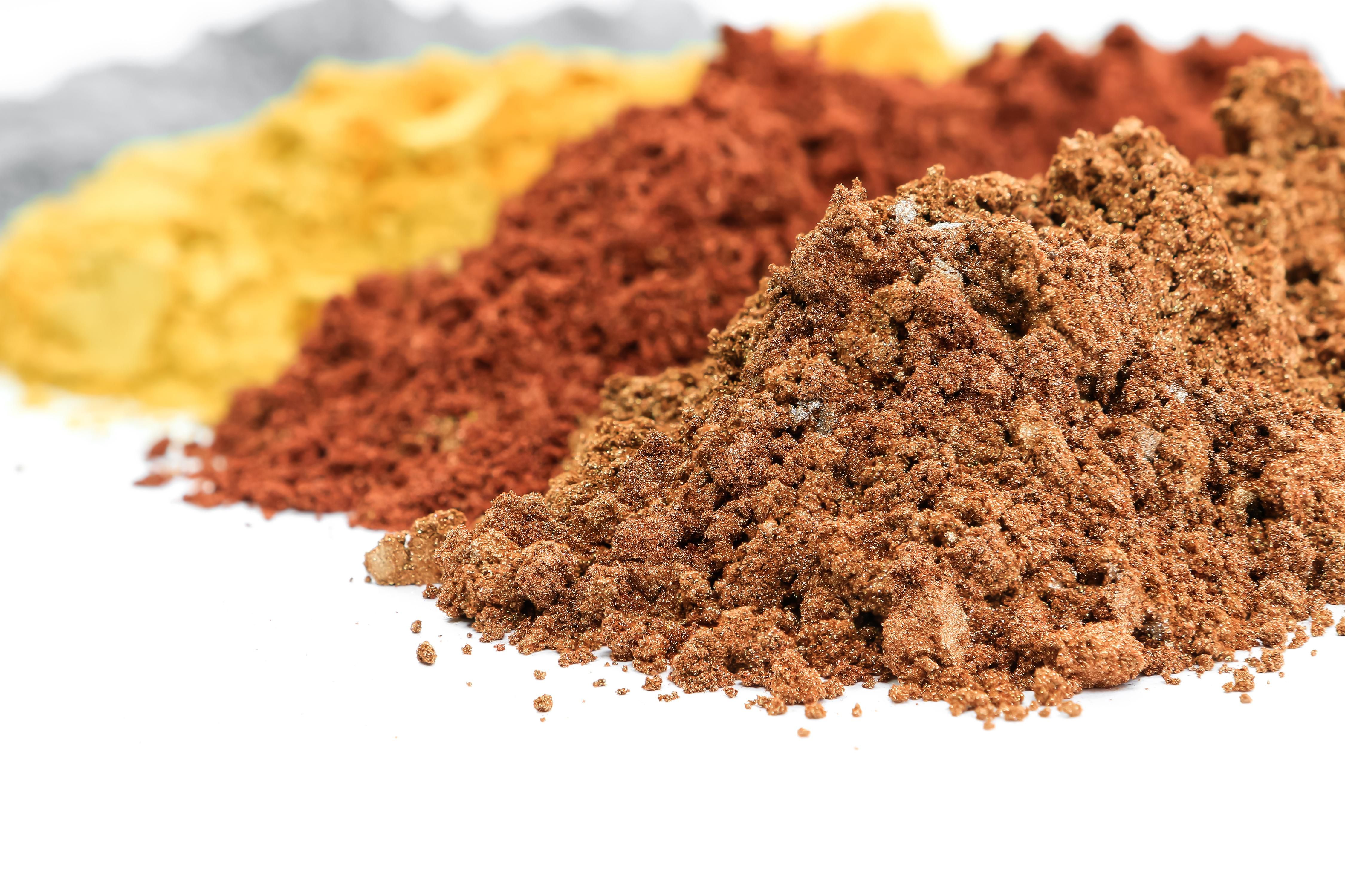 piles of colorful pigment powders for coating