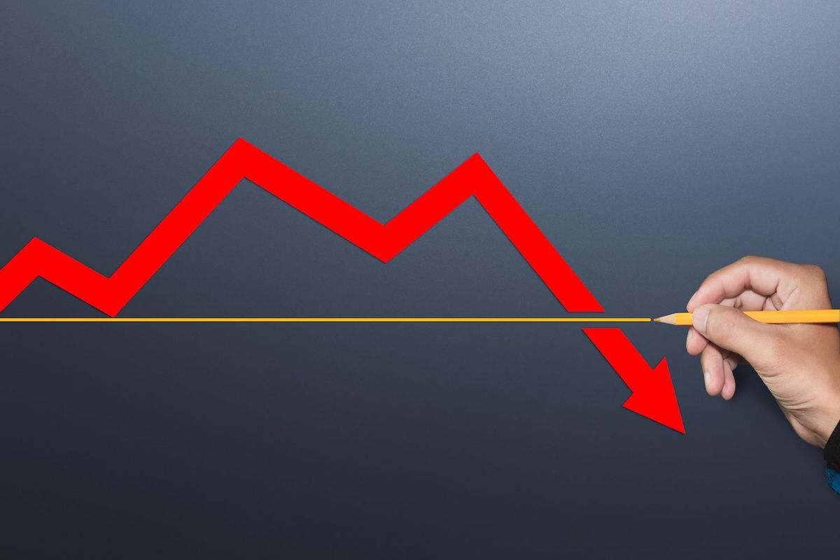 Red arrow trending down.