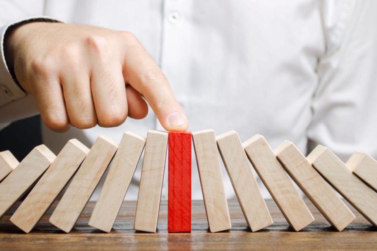 red block standing upright with light brown blocks