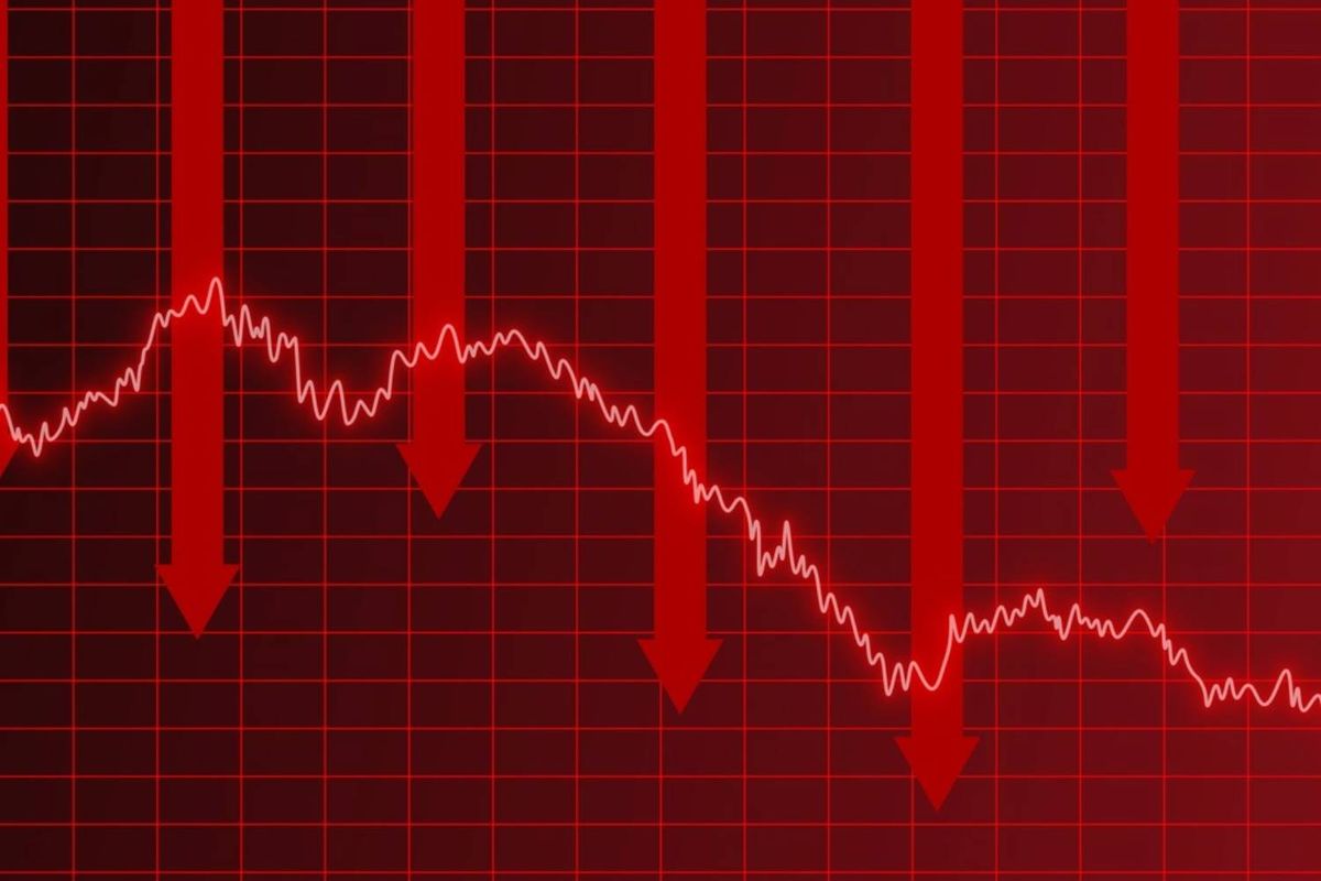 Red grid background with downward red arrows and fluctuating white line graph.