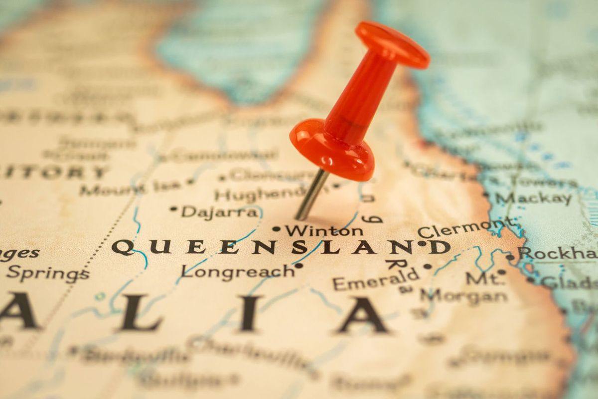 Red pushpin marking Queensland on a detailed map of Australia.