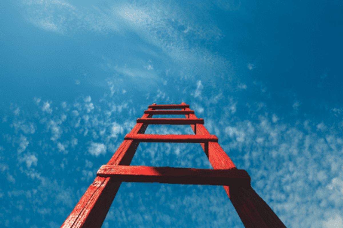 red staircase leading up towards blue sky