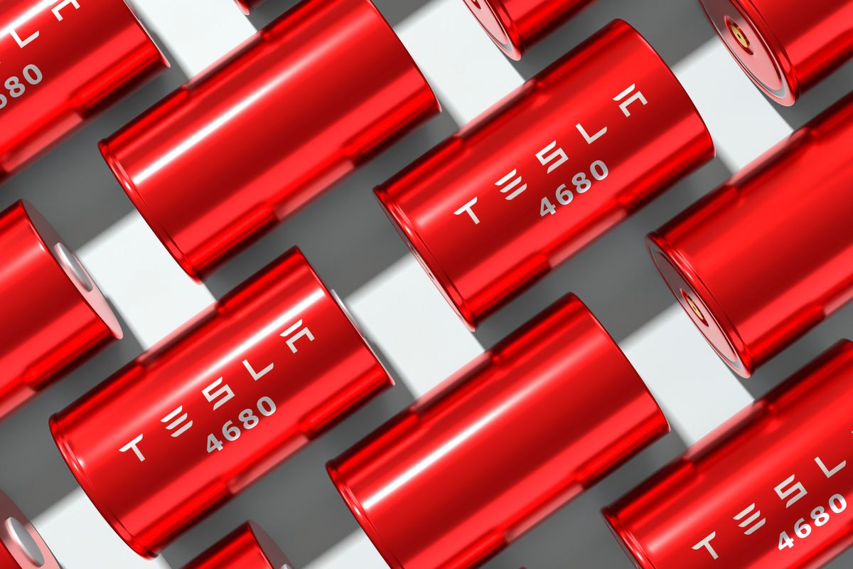 red tesla batteries over white background