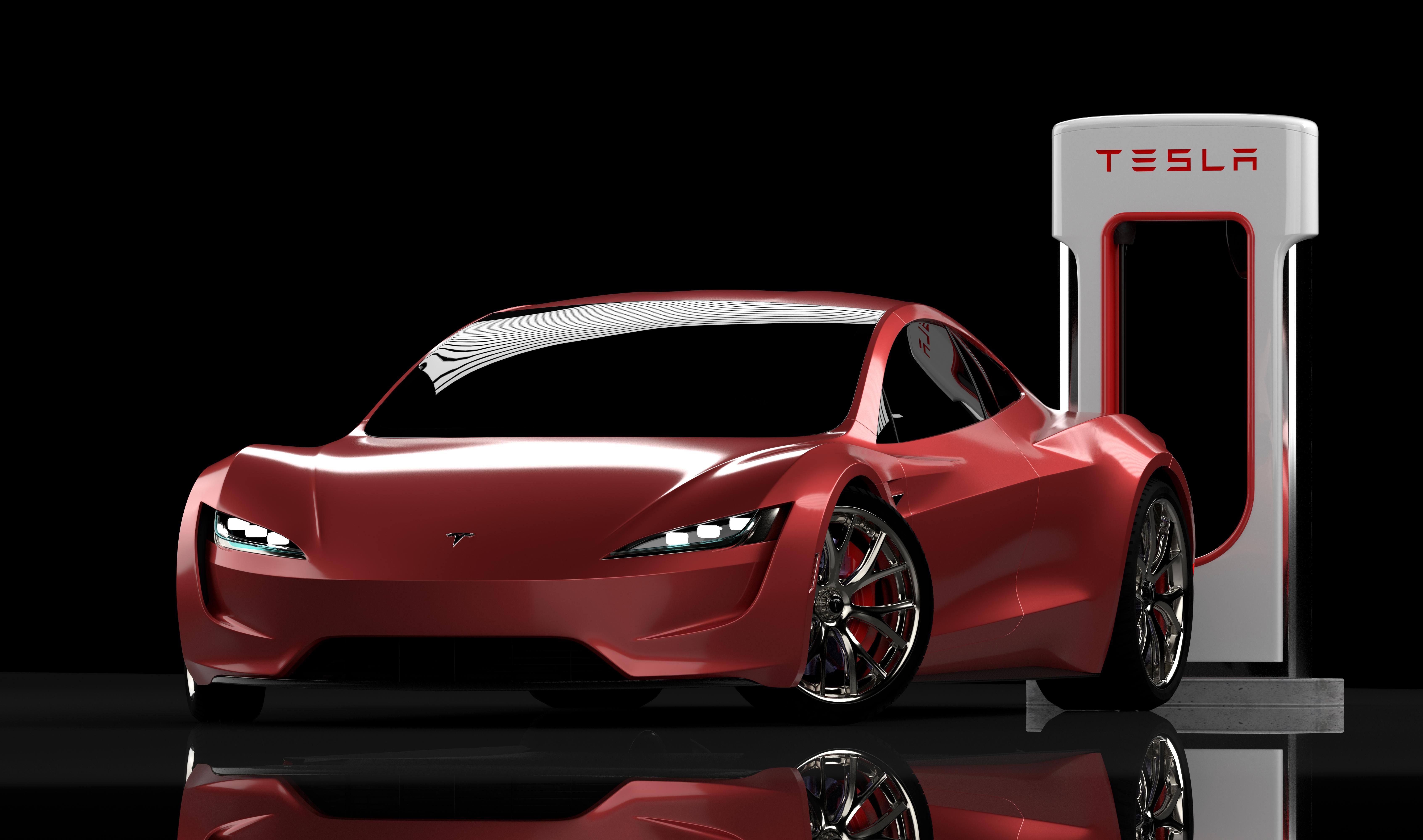 Red Tesla card in front of charging station.