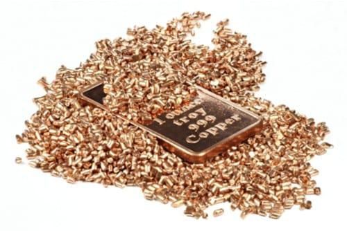 refined copper pieces on top of a 1 ounce copper bar