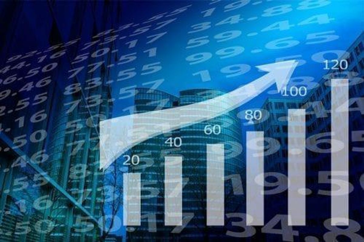 Rising graph and bar chart overlaid on a cityscape background.