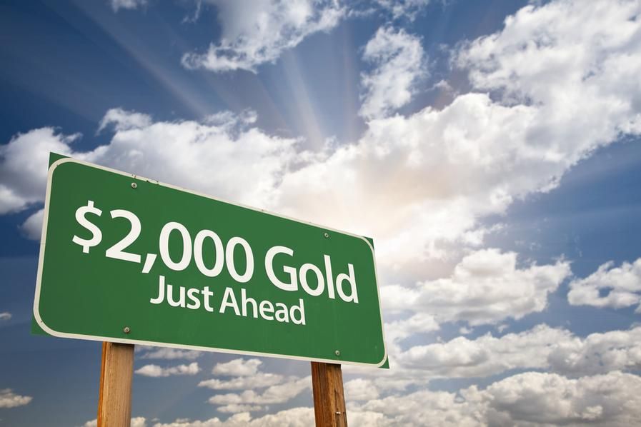 road sign displaying "US2,000 Gold Just Ahead"