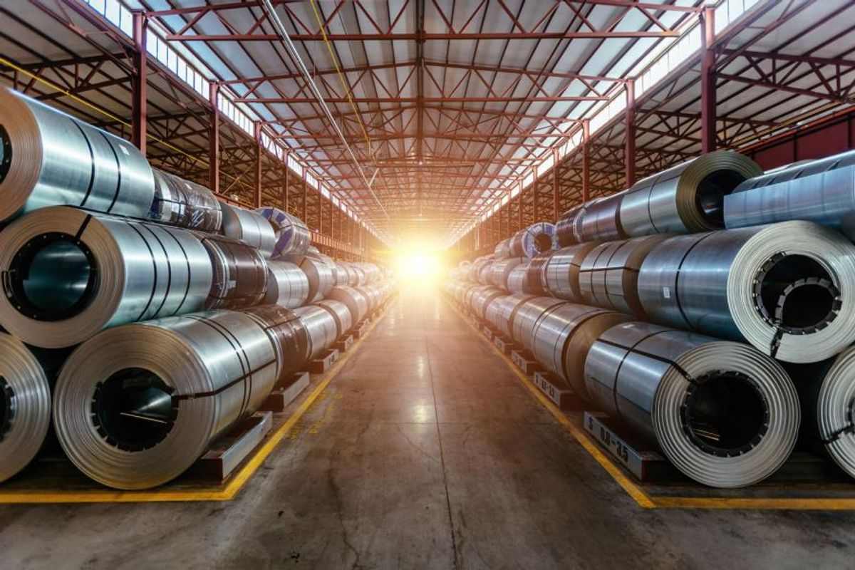 Rolls of steel in a warehouse.