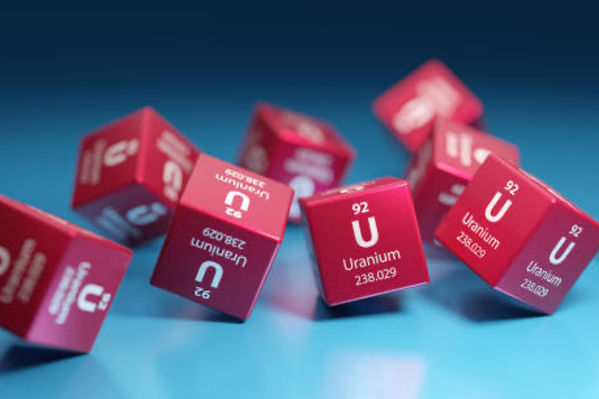 Several red cubes that display the uranium periodic table information on each side.