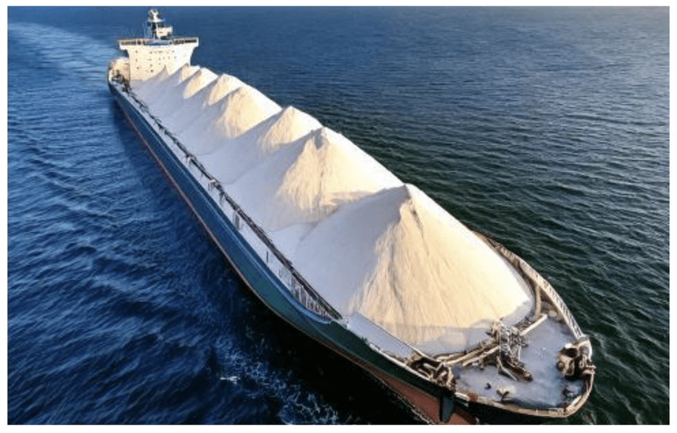 Ship carrying large mounds of white silica material from Homerun Resources' Santa Maria Eterna Silica District