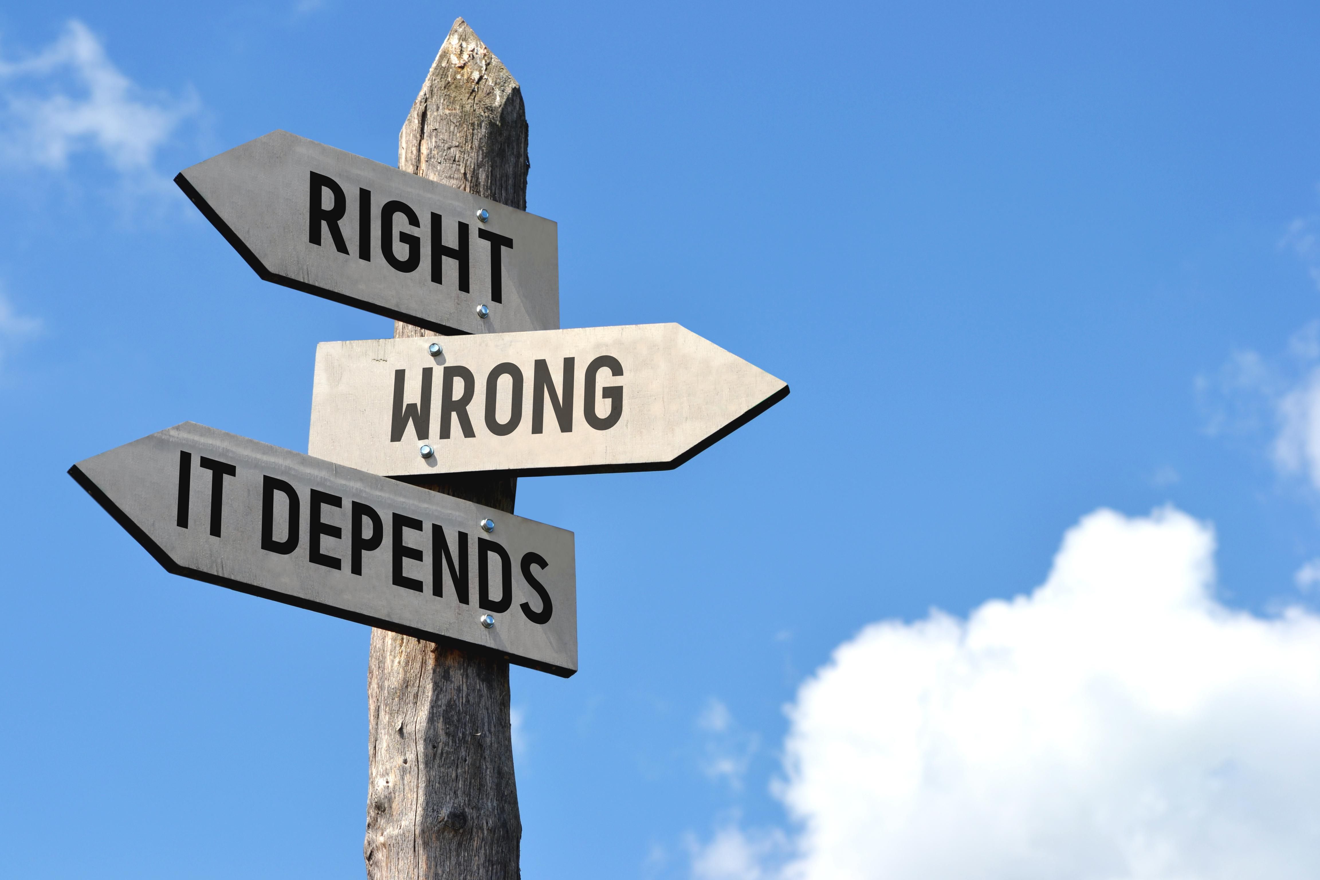 sign post with arrows pointing to "right," "wrong" and "it depends"