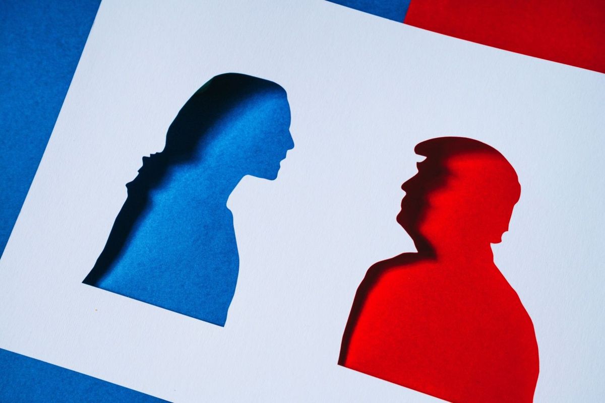 Silhouettes of Kamala Harris and Donald Trump.