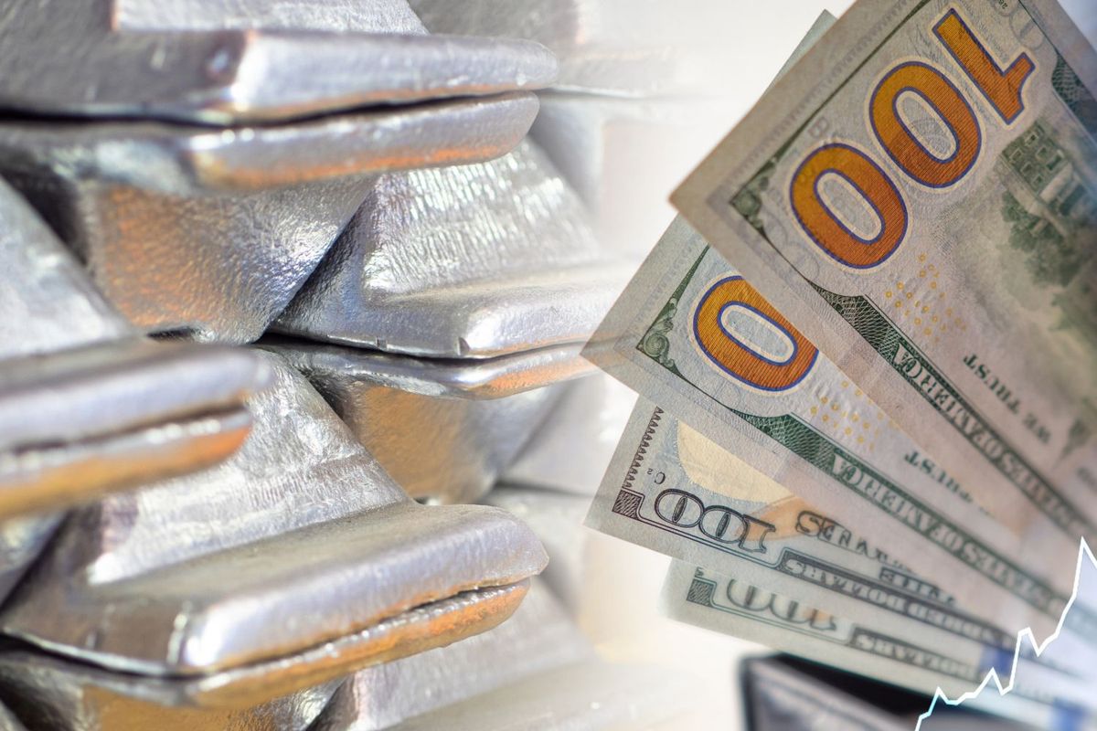 Silver bars and US$100 bills with a rising chart overlay.