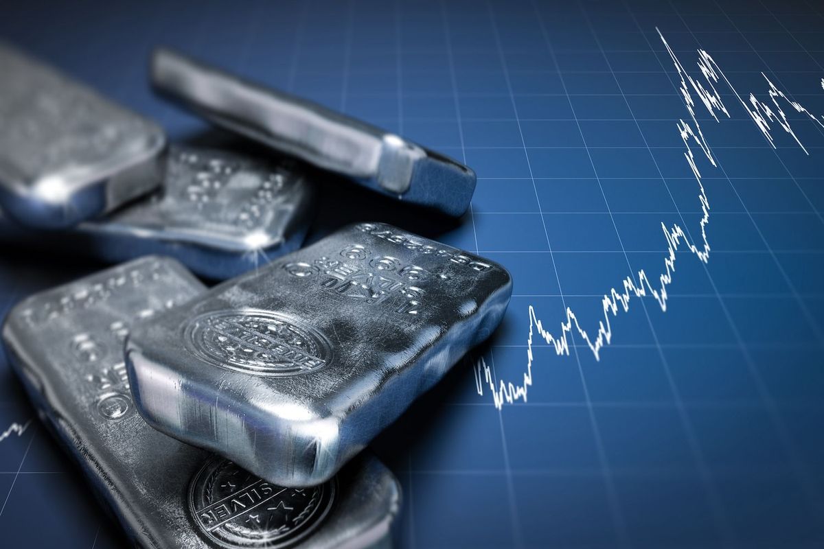 Silver bars on blue grid background with fluctuating line graph.