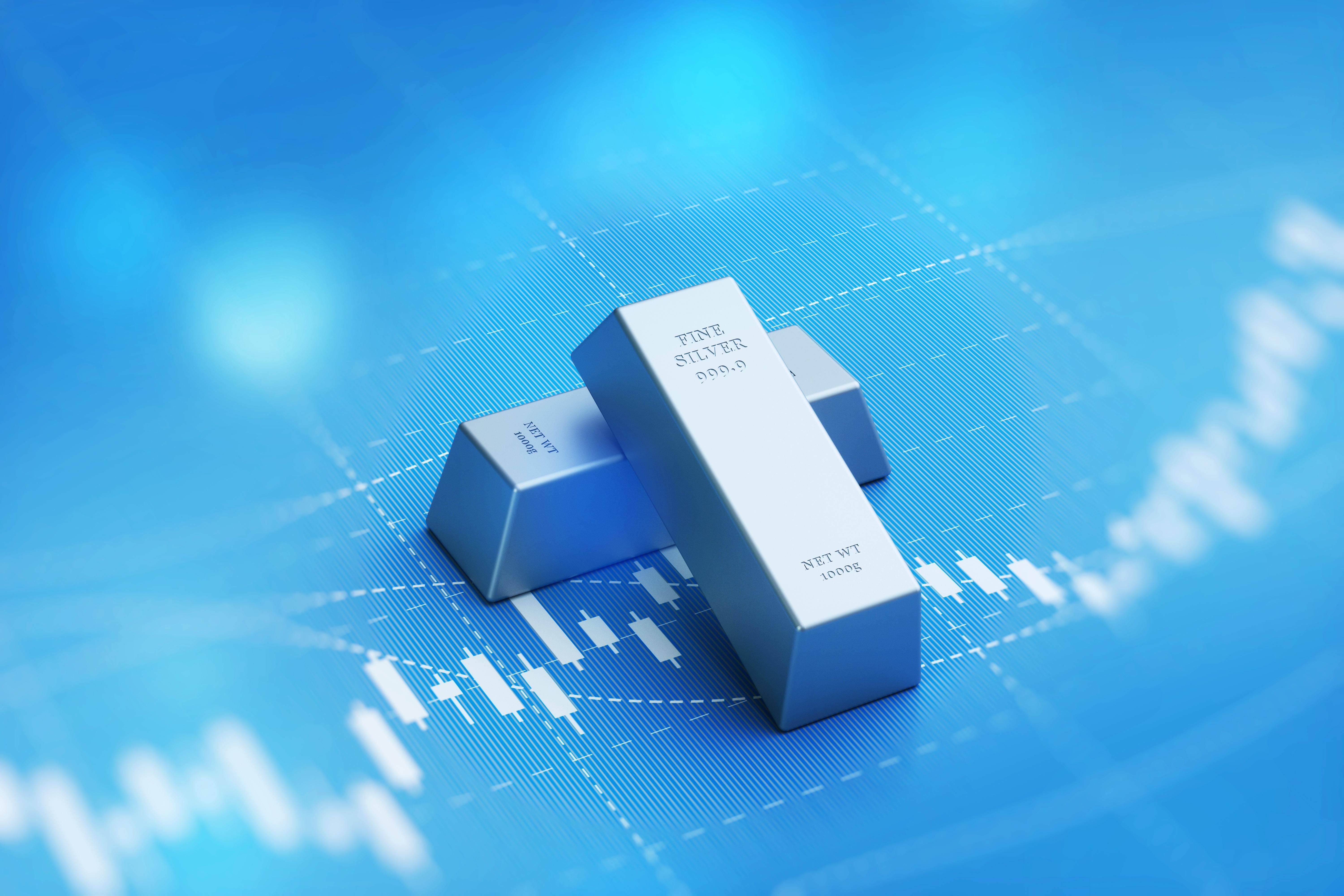silver bars over blue price chart