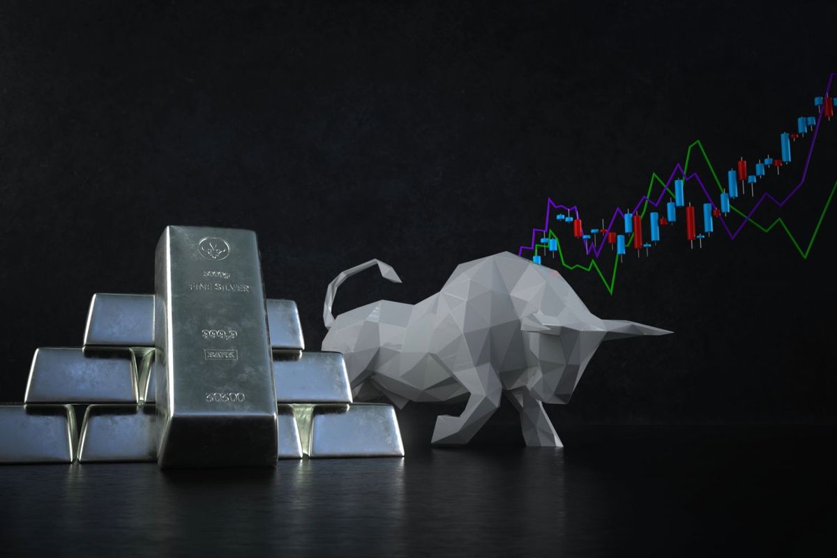 Silver bars, silver bull and stock chart.
