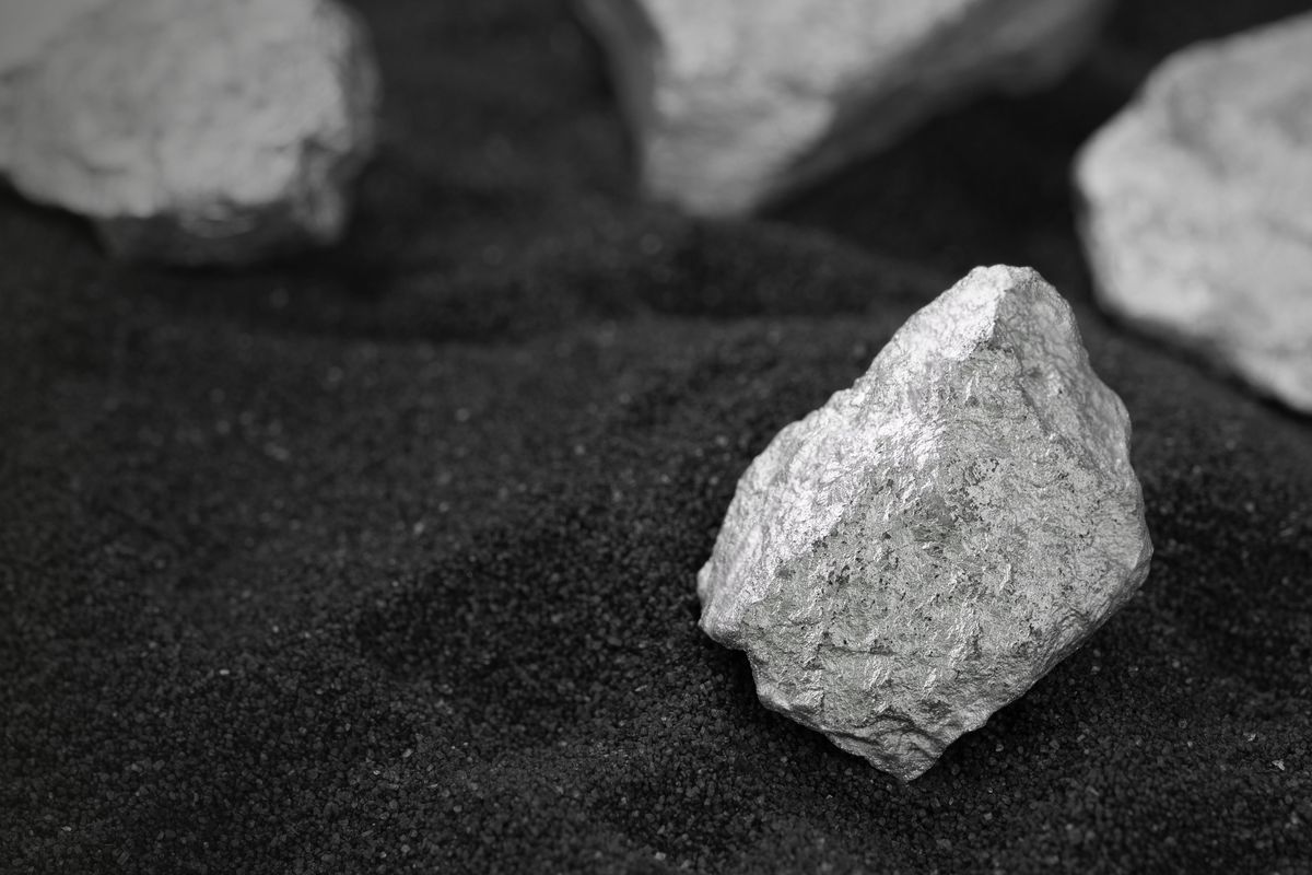 silver ore over black powder