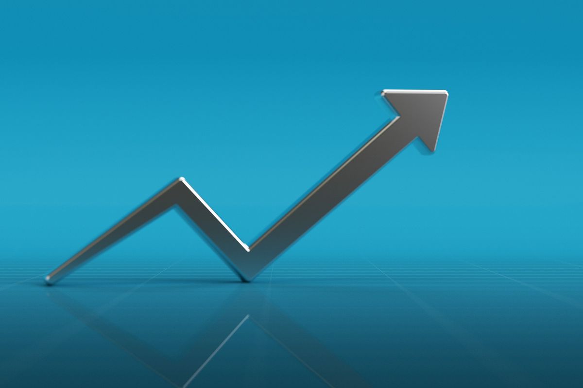 silver up arrow on shiny aquamarine surface